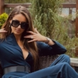 Patrycja Tuchlińska w niebieskim kombinezonie